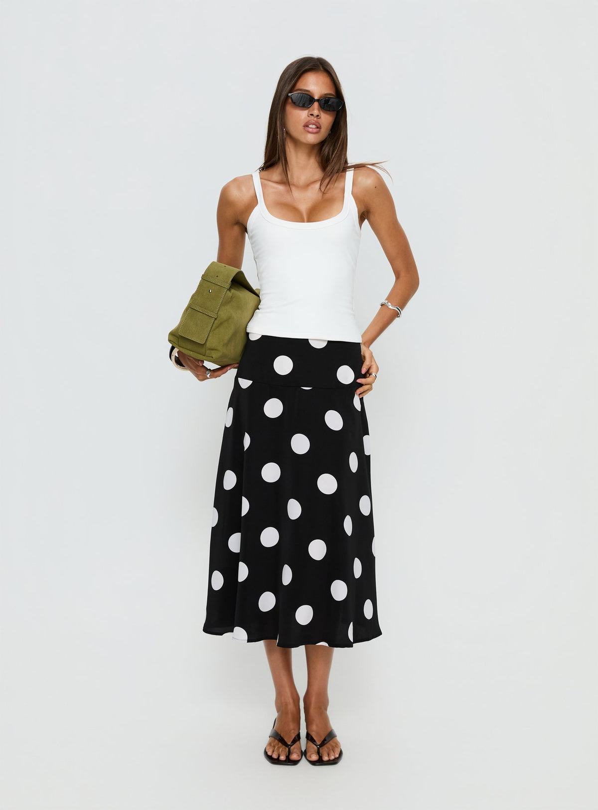   side view of model wearing Princess Polly Picture It Midi Skirt Black Polka Dot Midi Skirts 