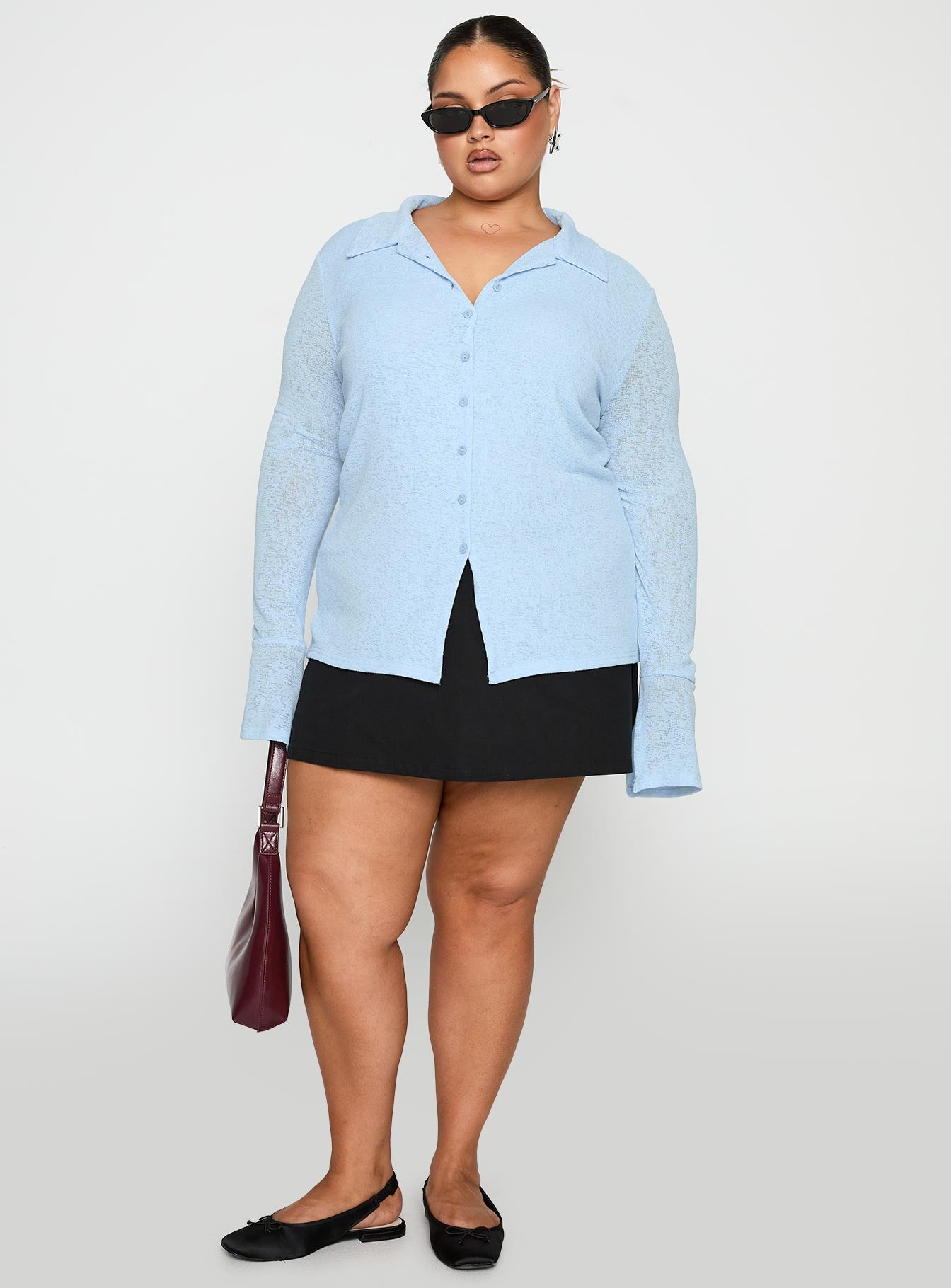 front view of model wearing Princess Polly Finnean Long Sleeve Top Pale Blue Curve Full Sleeves V-Neck 