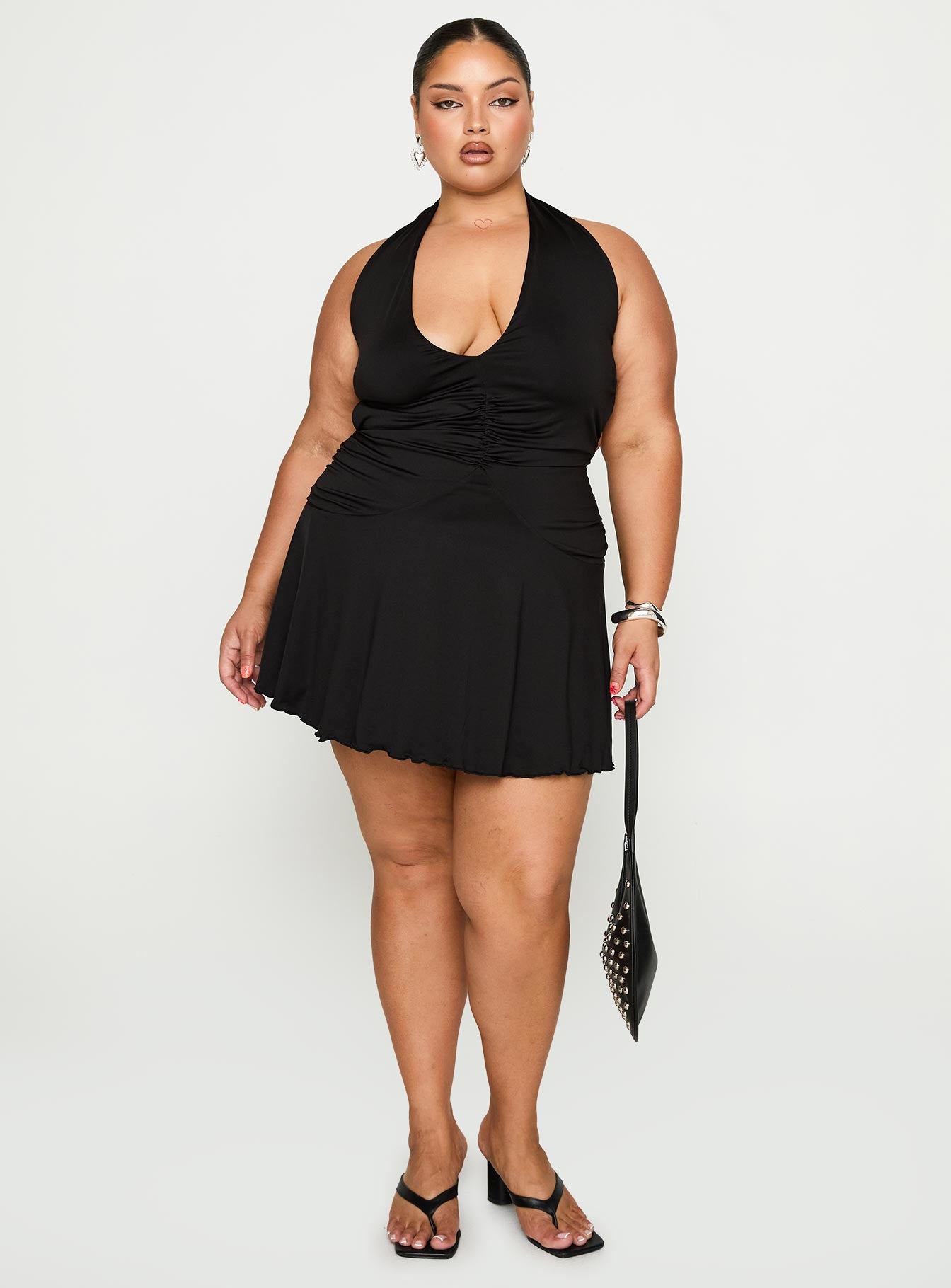 front view of model wearing Princess Polly Maeva Halter Mini Dress Black Curve Plunger 