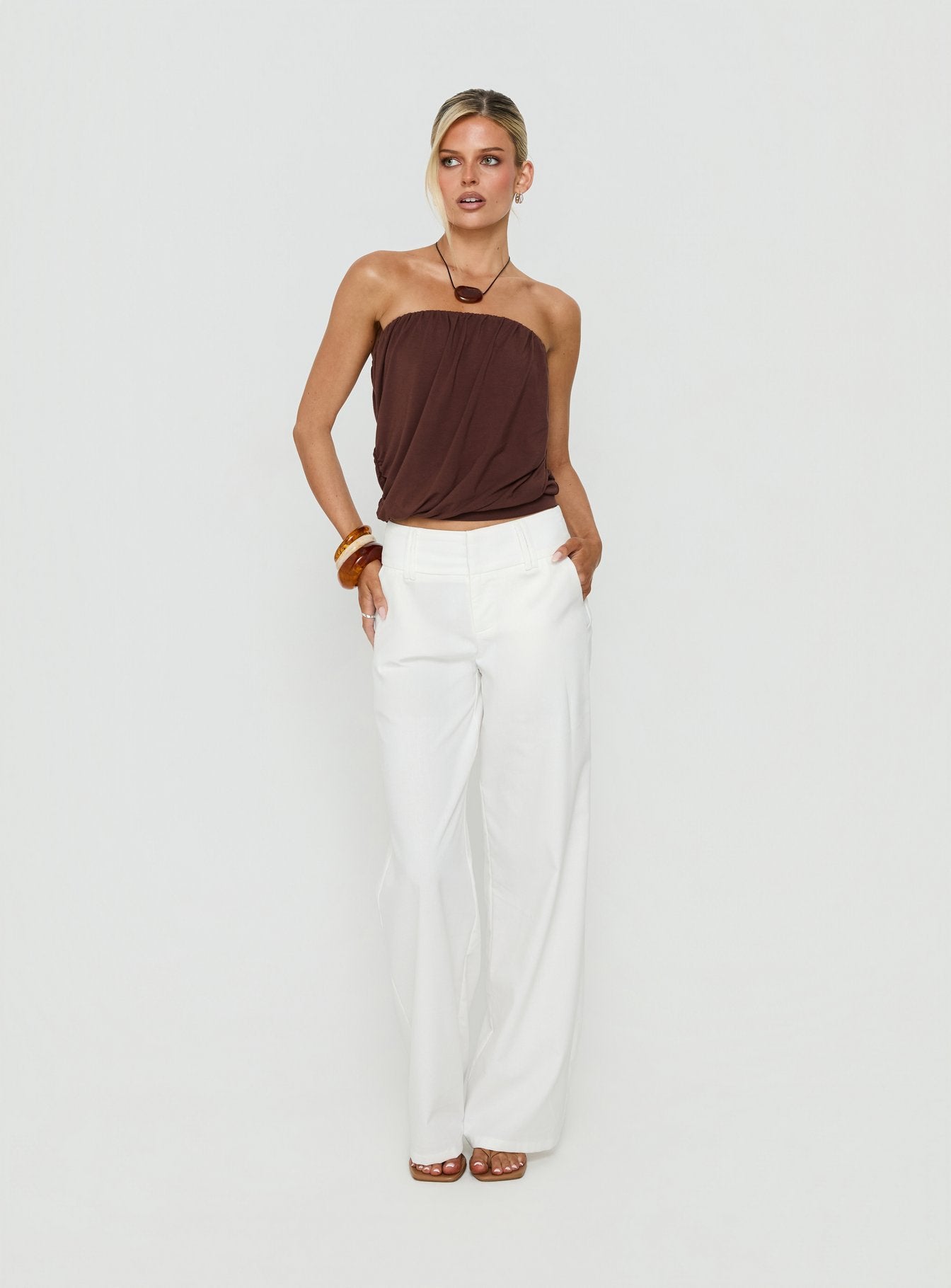 Showcasing the Two Lovers Linen Low Rise Pants White in womens regular pants, featuring low-rise waistband and wide-leg silhouette, front view of model wearing