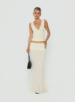 Crafted from jersey fabric the Zespri Maxi Skirt in Cream Polka Dot for womens-skirts with fitted a-line shape and lace hem front view of model wearing Princess Polly