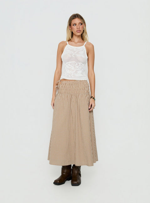 Showcasing the Vence Ruched Maxi Skirt Brown Gingham in womens-skirts with checkered print and relaxed a-line shape front view of model wearing Princess Polly