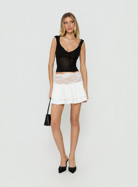 Showcasing the Kecia Lace Waistband Mini Skirt White in womens-skirts featuring mini length front view of model wearing Princess Polly
