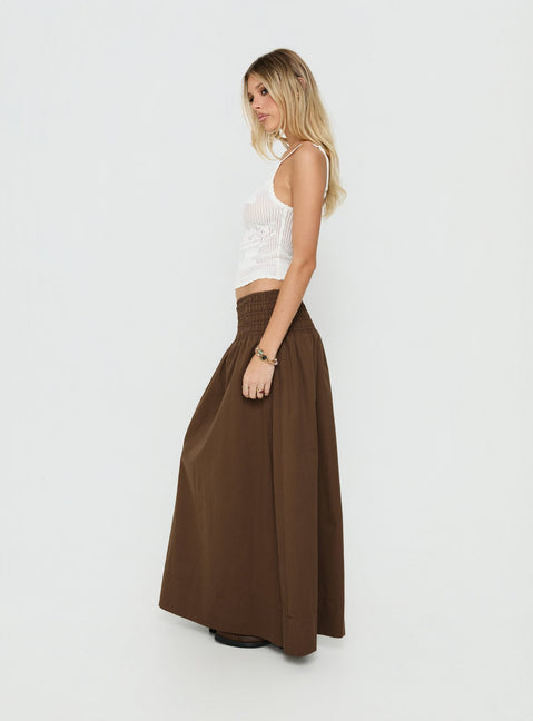 Crafted with the Thessa Ruched Maxi Skirt Chocolate in womens-skirts featuring maxi length side view of model wearing Princess Polly