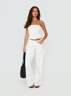 side view of model wearing Princess Polly Supercut Low Rise Baggy Pleat Jeans Cream Mid Rise Jeans Jeans 