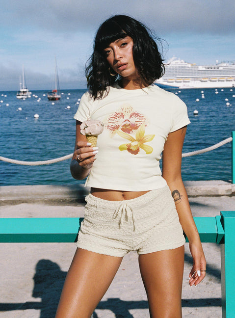 front view of model wearing Princess Polly Blooming Orchids Graphic Top Cream Short Sleeves Crew Neck 