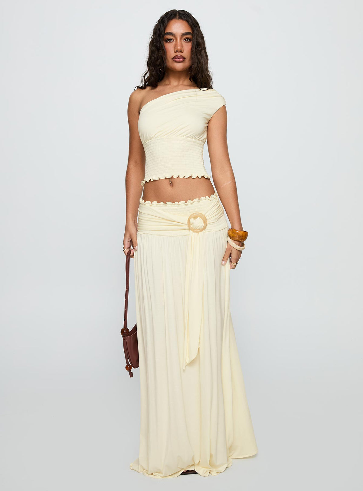 front view of model wearing Princess Polly Full Orbit One Shoulder Top Cream Sleeveless Asymmetric Neckline 