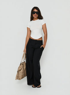 Featuring Loved Up Low Rise Baggy Pants Black in womens regular pants front view of model wearing Princess Polly