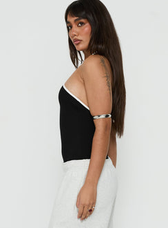 Featuring sleeveless styling, the Azara Contrast Arrowneck Bodysuit Black / White womens-bodysuit side view of model wearing Princess Polly