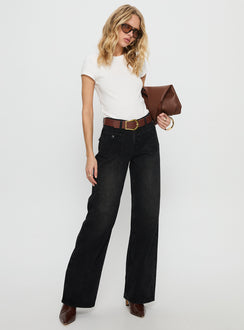 side view of model wearing Princess Polly Carianne Low Rise Wide Leg Jeans Washed Black Mid Rise Jeans 