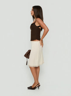 Featuring the Bella Lace Trim Midi Skirt Butter womens-skirts with midi length side view of model wearing