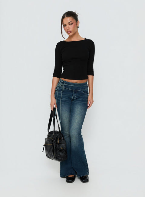 Showcasing Runa Low Rise Tie Side Jeans Mid Blue Wash in womens-jeans front view of model wearing Princess Polly