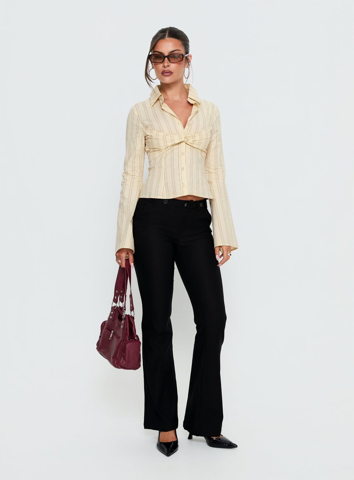 front view of model wearing Princess Polly Dariana Flare Pants Black Mid Rise Pants 