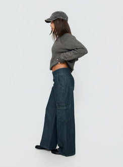 Crafted with the Nikoletta Mid Rise Wide Leg Cargo Jeans Dark Blue Wash in womens-jeans with mid-rise side view of model wearing