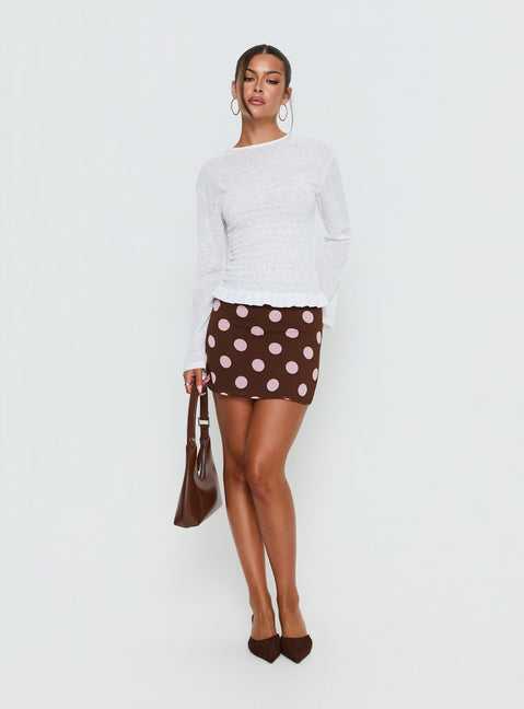   side view of model wearing Princess Polly Adelaida Mini Skirt Brown / Pink Polka Mini Skirts 