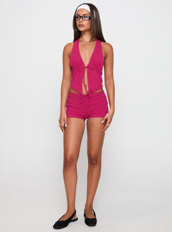 side view of model wearing Princess Polly Obviously Halter Top Pink Sleeveless Plunger 