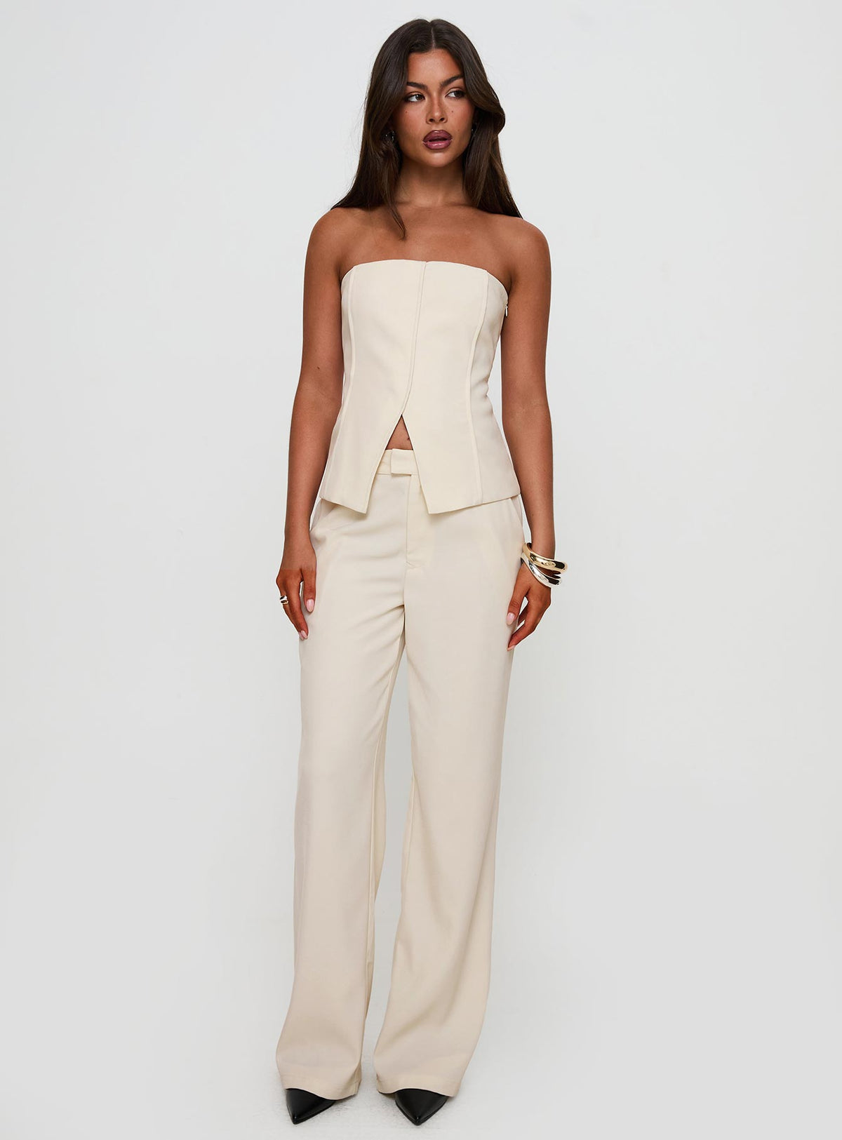 side view of model wearing Princess Polly Lavish Living Strapless Top Cream Sleeveless straight 