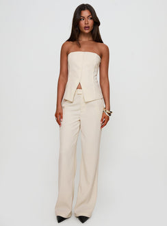 side view of model wearing Princess Polly Lavish Living Strapless Top Cream Sleeveless straight 