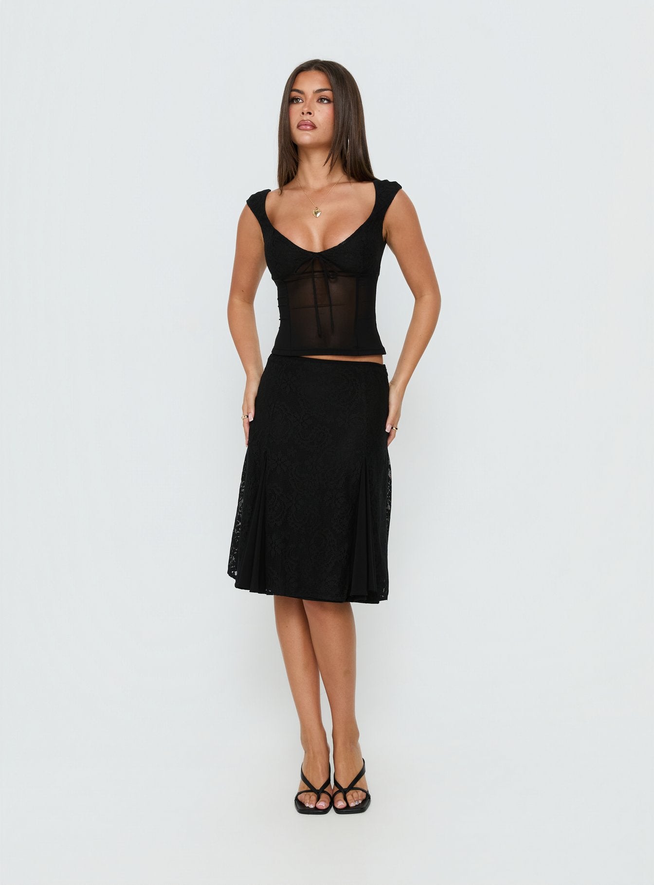 Showcasing the Quani Lace Midi Skirt Black womens-skirts in midi length front view of model wearing Princess Polly