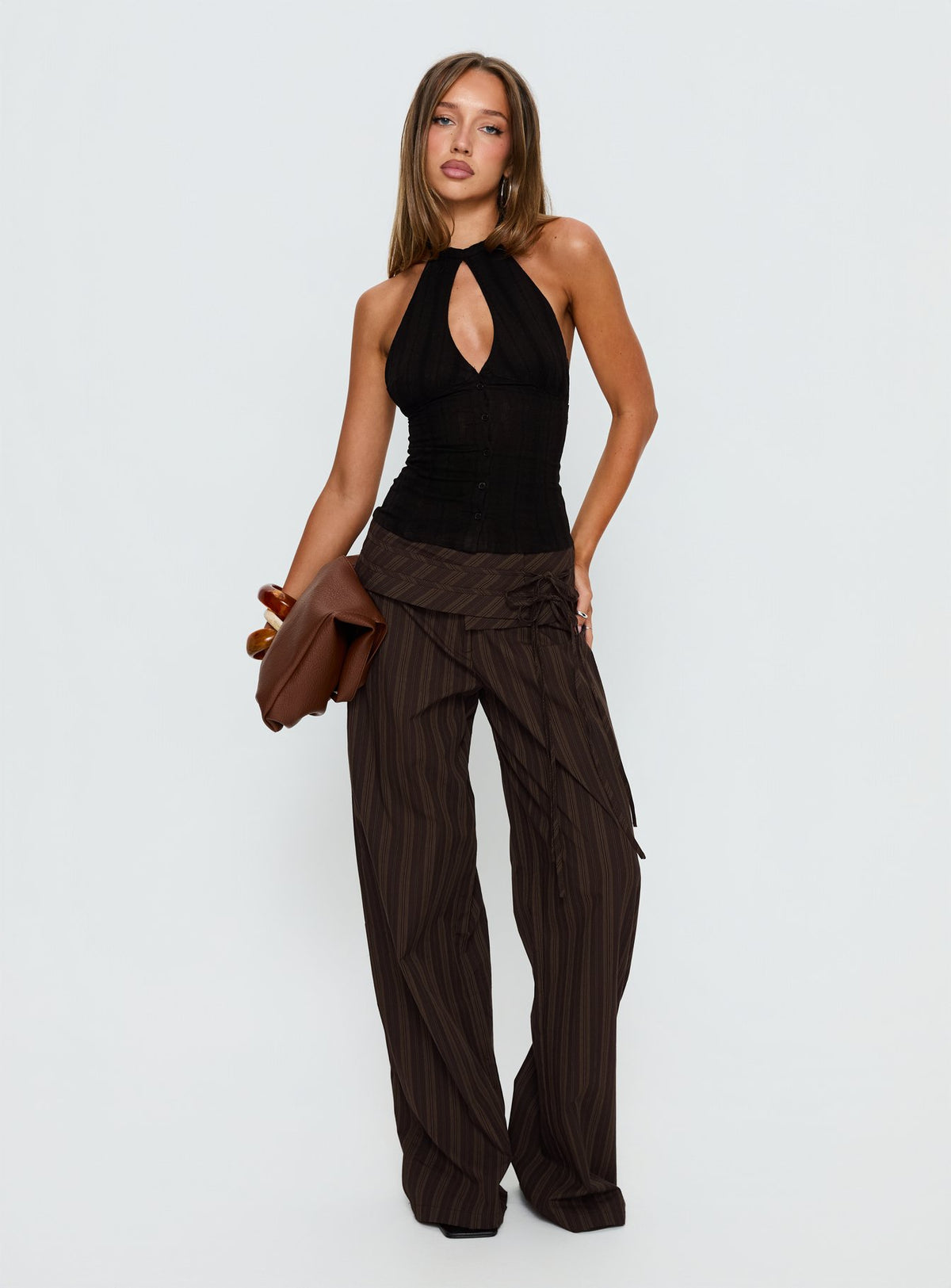 front view of model wearing Princess Polly Seneca Wrap Pant Brown Stripe Mid Rise Pants 