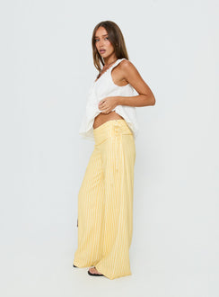 side view of model wearing Princess Polly Silver Moon Pants Yellow Stripe Low Rise Pants 