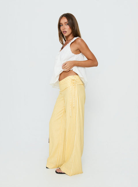 side view of model wearing Princess Polly Silver Moon Pants Yellow Stripe Low Rise Pants 