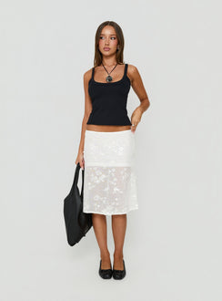 Showcasing the Heart Stealer Sheer Sequin Midi Skirt in White with fitted a-line shape and frayed hem front view of model wearing Princess Polly