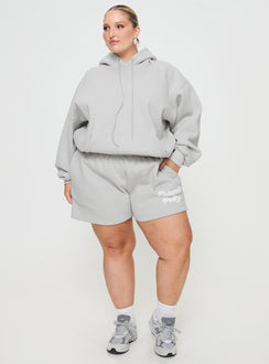 side view of model wearing Princess Polly Princess Polly Track Shorts Puff Text Grey Curve 