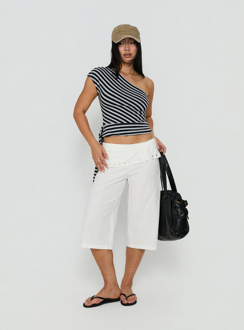 Crafted from ivory the Oren Capri Trouser womens-regular-pants with mid-rise and belt detail view of model wearing Princess Polly