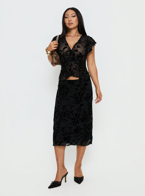 back view of model wearing Princess Polly Atira Midi Skirt Leaf Flower Black Midi Skirts Skirts 