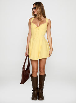 side view of model wearing Princess Polly Little White Lies Mini Dress Lemon Sweetheart Neckline 