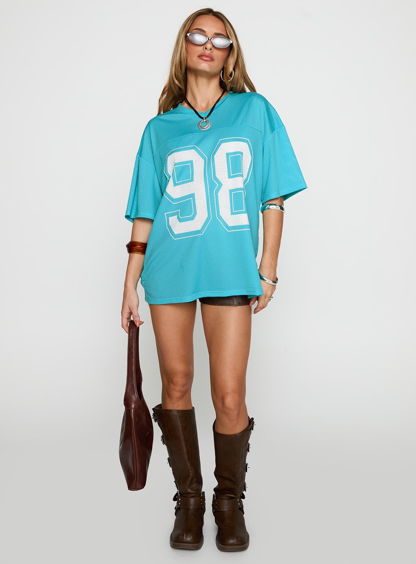 front view of model wearing Princess Polly 98 Sports Graphic Top Blue Half Sleeves V-Neck 