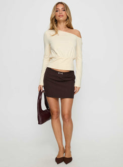   side view of model wearing Princess Polly Yellena Buckle Mini Skirt Brown Pinstripe Mini Skirts Skirts 