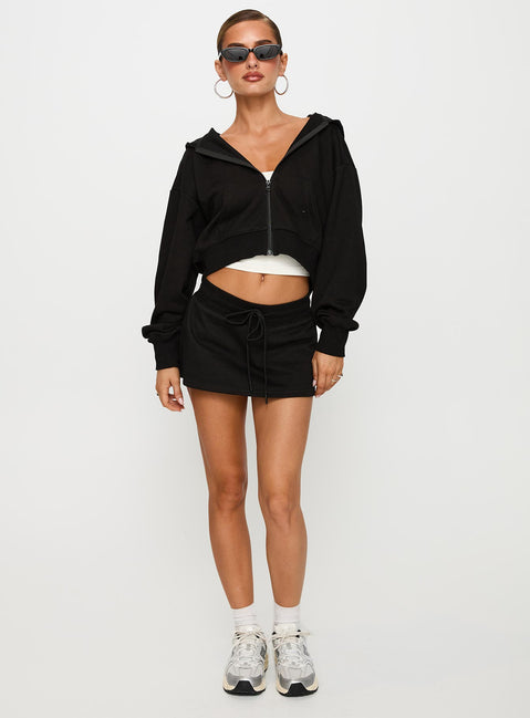 front view of model wearing Princess Polly Down Low Fleece Skort Black Low Rise Shorts 