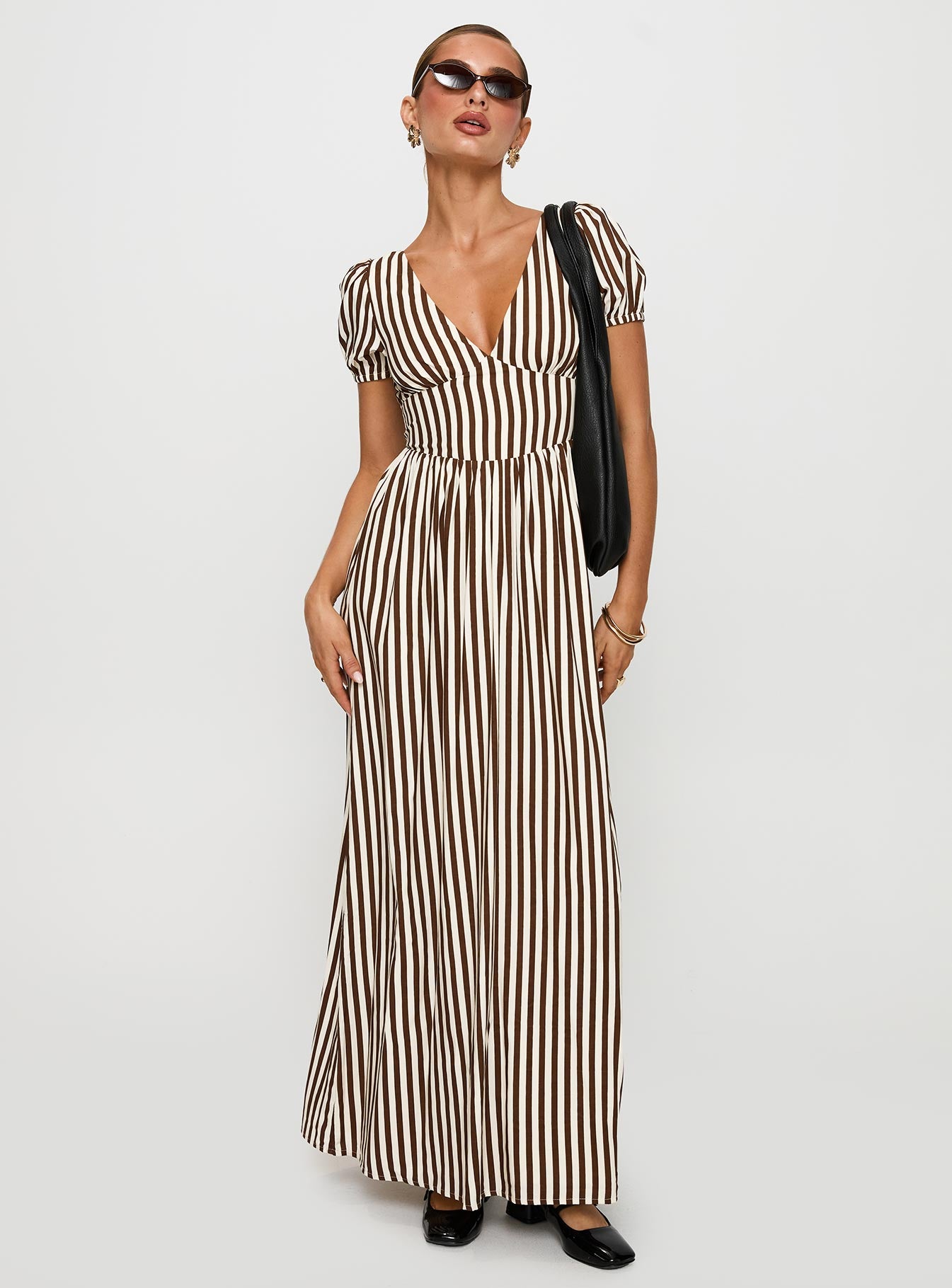 side view of model wearing Princess Polly Collyns Maxi Dress Beige Pinstripe V-Neck 