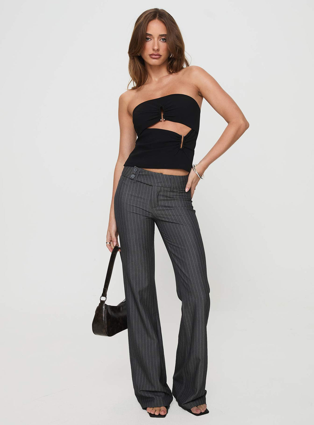 front view of model wearing Princess Polly Kinkirk Flared Pants Grey Pinstripe Petite 