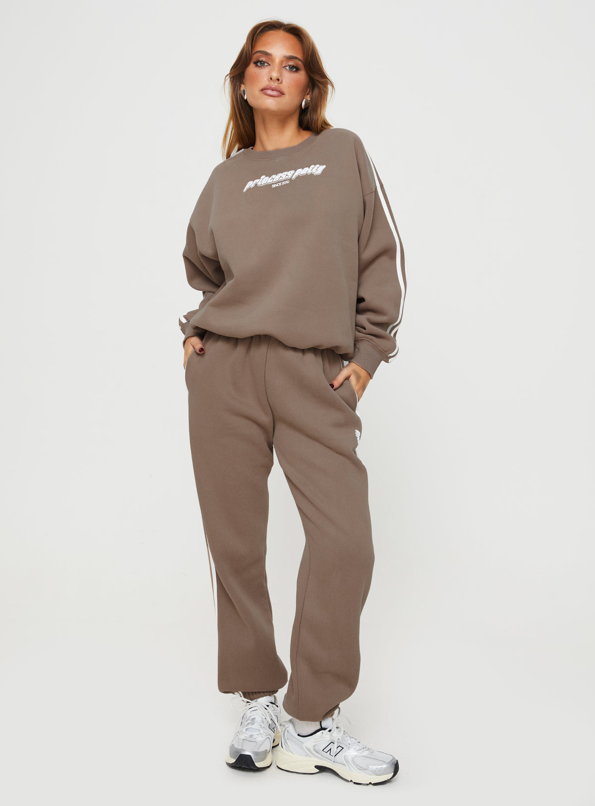 back view of model wearing Princess Polly Princess Polly Crew Neck Sweatshirt Stripe Taupe / White regular 