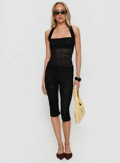 front view of model wearing Princess Polly Babydoll Capri Pants Noir Mid Rise Pants 