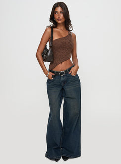 side view of model wearing Princess Polly Low Rise Wide Leg Jean Hocus Pocus Wash Low Rise Jeans 