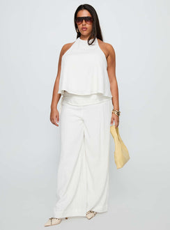 side view of model wearing Princess Polly Aquaria Halter Linen Blend Top White Curve Sleeveless Crew Neck 