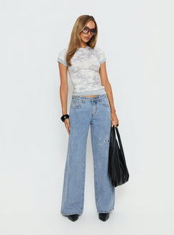 front view of model wearing Princess Polly Candi Mid Rise Wide Leg Studded Jeans Light Blue Wash Mid Rise Jeans 