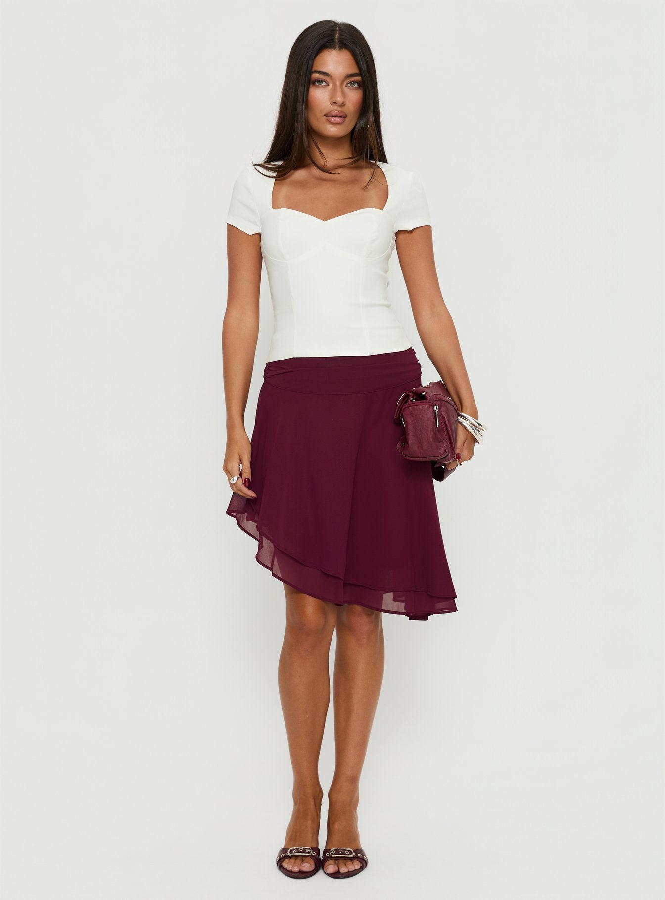   front view of model wearing Princess Polly Evanescence Asymmetrical Midi Skirt Cherry 