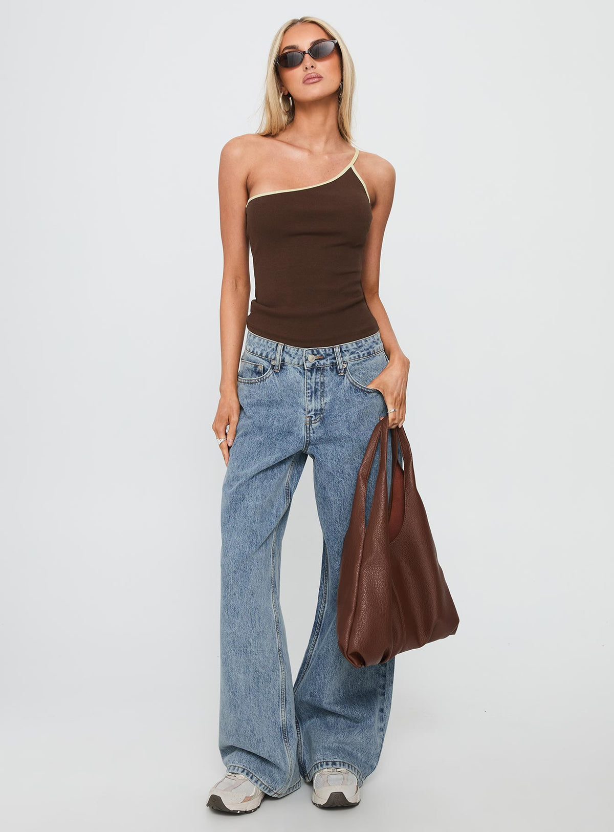 front view of model wearing Princess Polly Shima Low Rise Straight Leg Jeans Light Wash Low Rise Jeans Jeans 