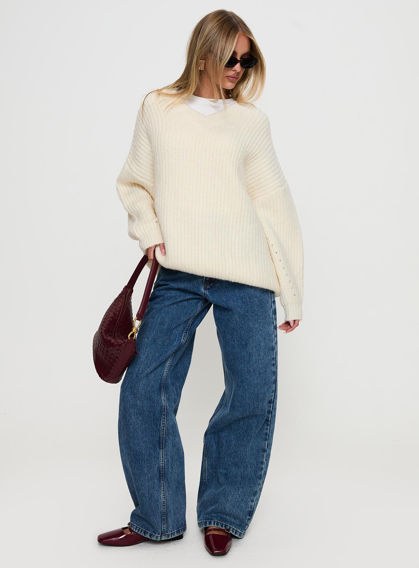 side view of model wearing Princess Polly Have It All V Neck Knit Sweater Cream Long 