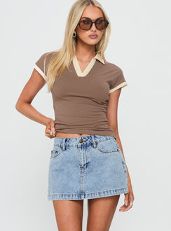   front view of model wearing Princess Polly Nicolina Low Rise Denim Mini Skirt Ice Blue Wash Tall Mini Skirts Skirts 
