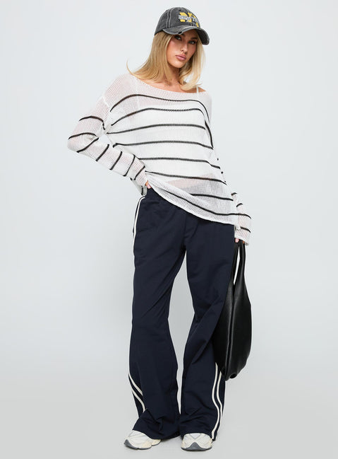side view of model wearing Princess Polly Alperton Knit Sweater Cream Stripe Long 