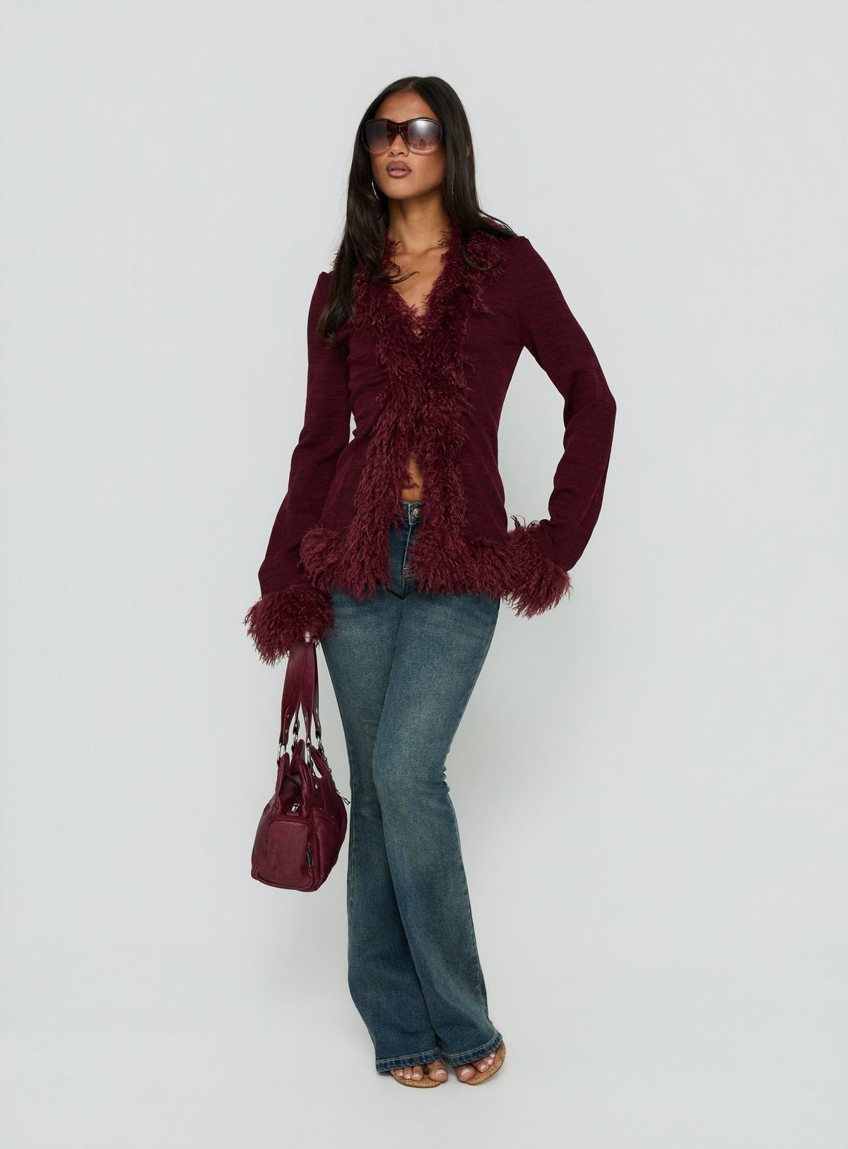 Introducing the Brynlie Faux Fur Trim Boxy Cardigan Burgundy womens jumper with short length front view of model wearing Princess Polly