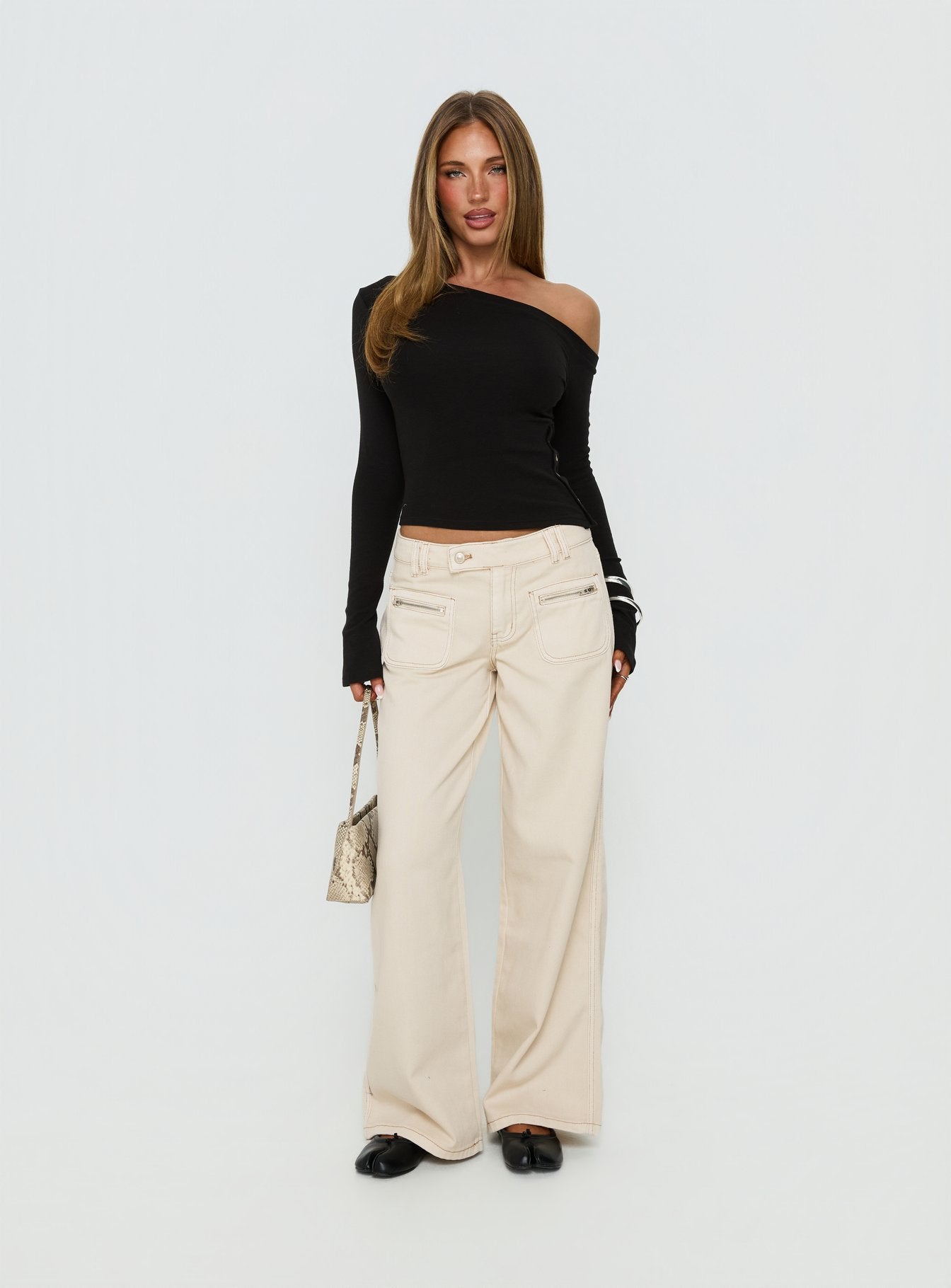 front view of model wearing Princess Polly Lifetimes Mid Rise Wide Leg Cargo Jeans Cream Mid Rise Jeans Jeans 