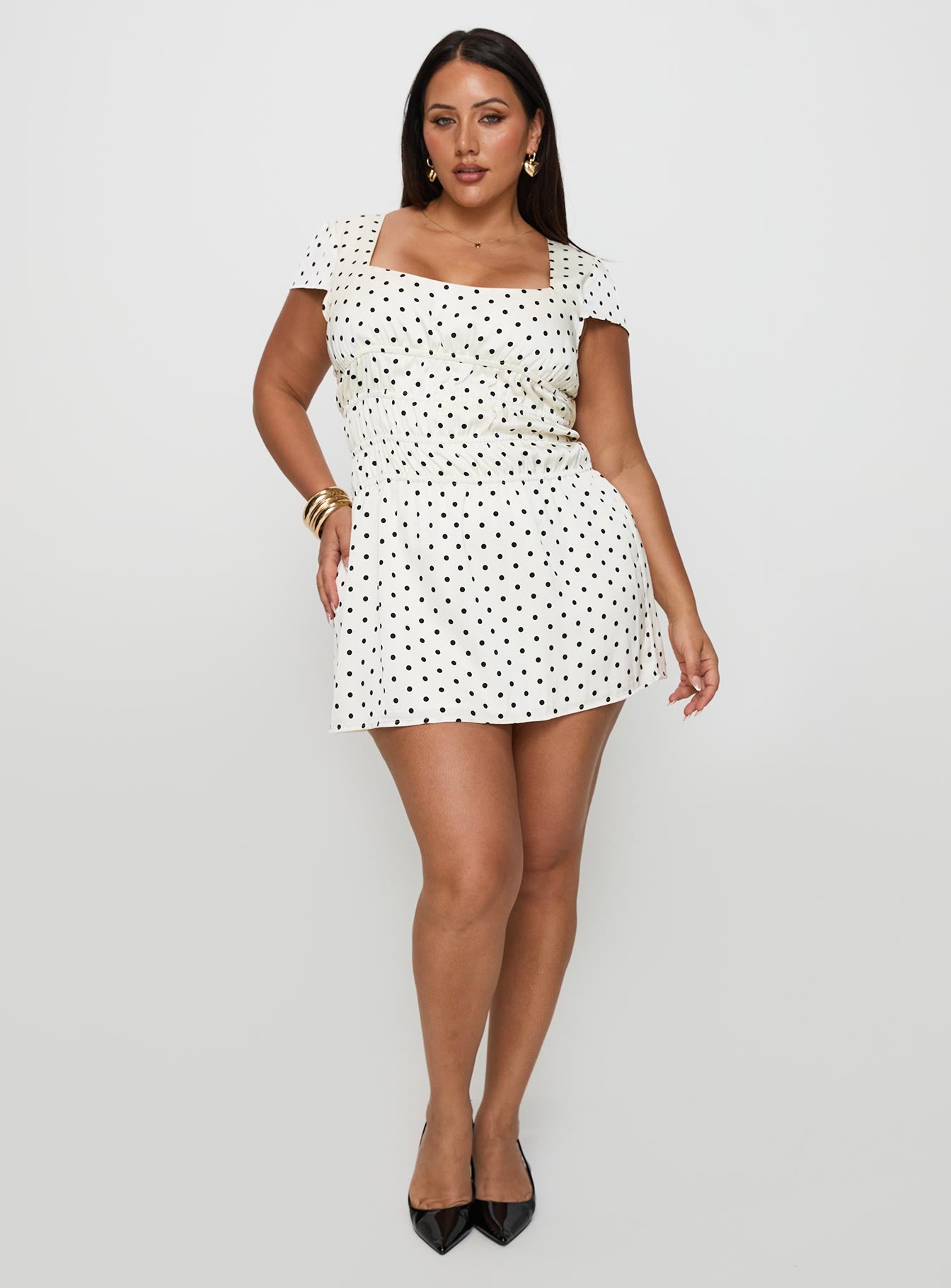 side view of model wearing Princess Polly Evangelie Ruched Mini Dress White Polka Curve Square Neck 