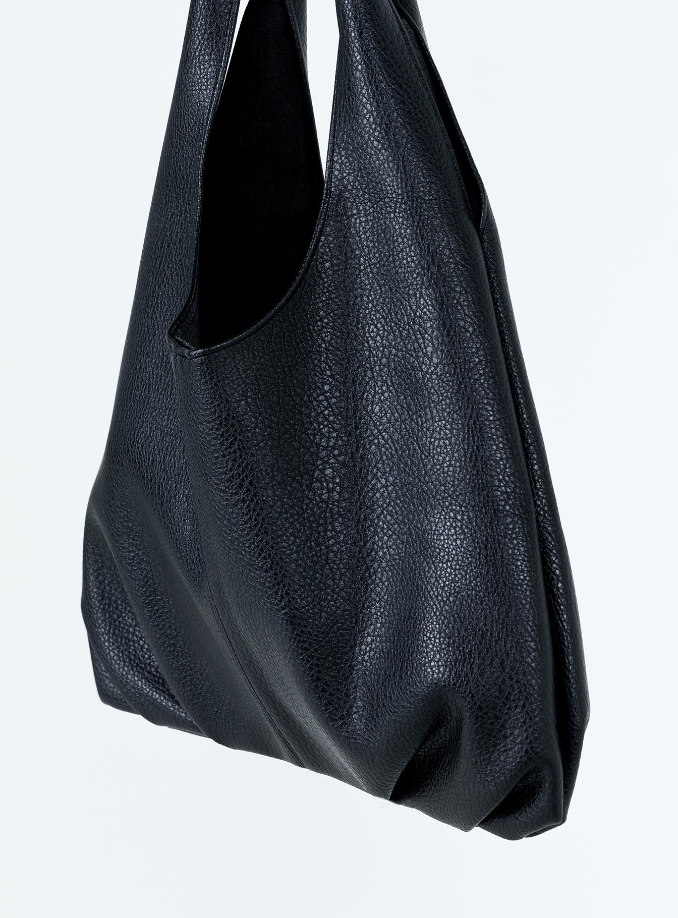 Shoulder bag Faux leather material Twin fixed handles Magnetic button fastening Separate clutch with zip fastening Gold toned hardware